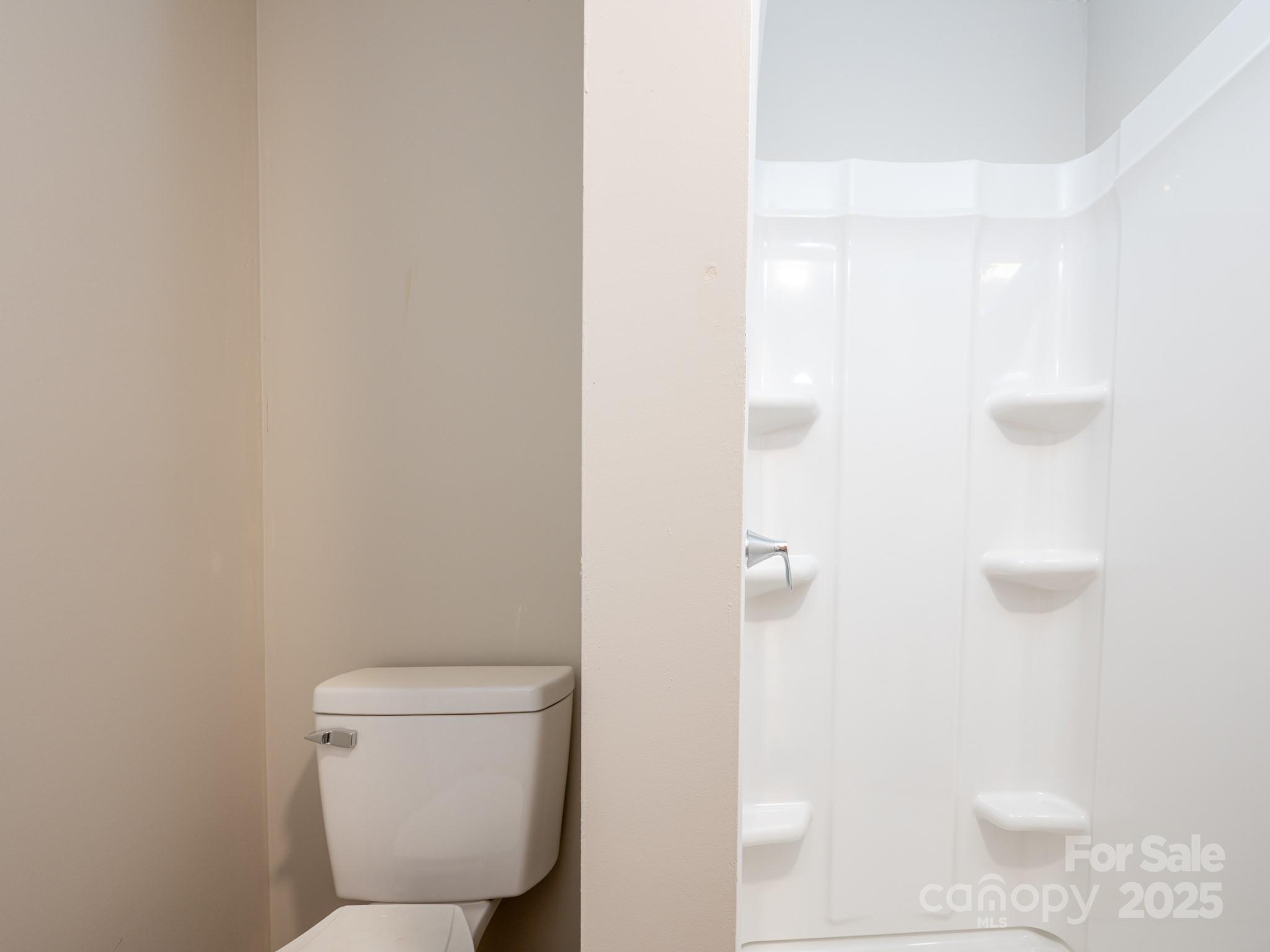 6458 Hudlow Road Union Mills, NC 28167 - Photo 7 of 16 a bathroom with a toilet and a shower