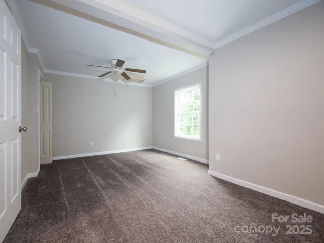 an empty room that has a window in it