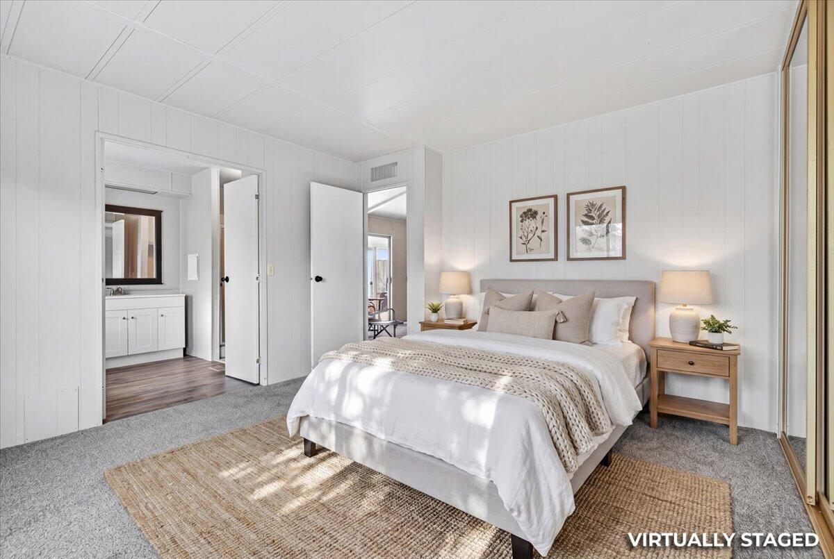 555 Freeman Road, Unit 127 Central Point, OR 97502 - Photo 11 of 32 a bedroom with a bed and a table