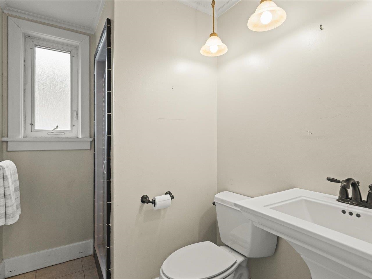 2014 Glenview Road Rockford, IL 61107 - Photo 14 of 82 a bathroom with a toilet a sink and mirror