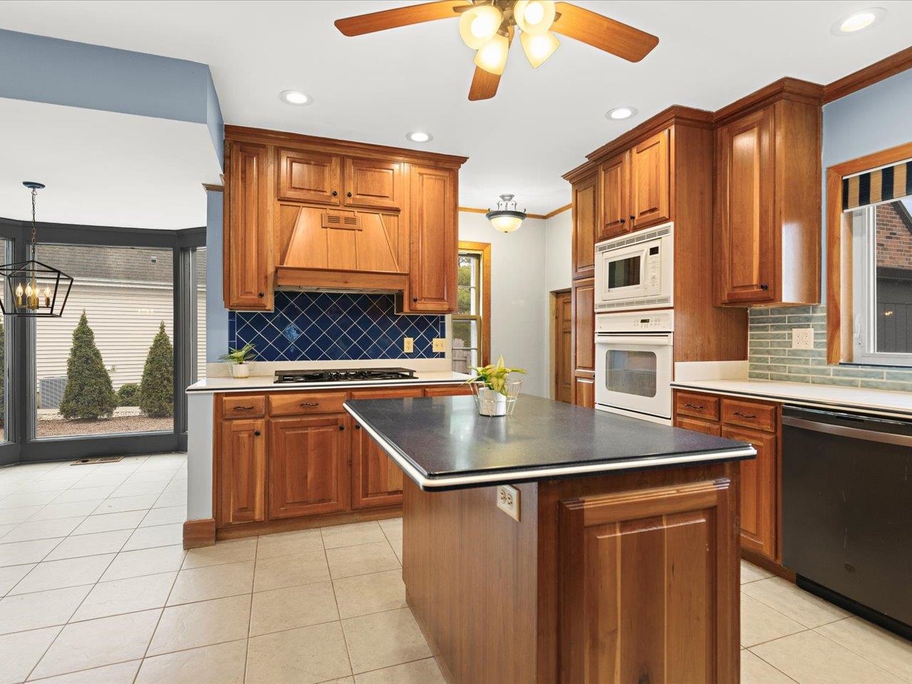 2014 Glenview Road Rockford, IL 61107 - Photo 21 of 82 a kitchen with stainless steel appliances granite countertop a sink a stove and cabinets