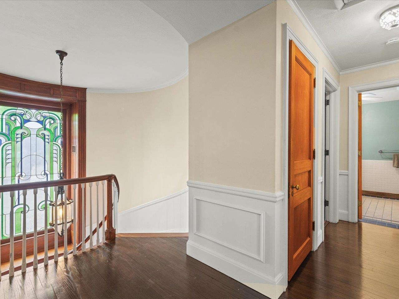 2014 Glenview Road Rockford, IL 61107 - Photo 37 of 82 a view of hallway with stairs and wooden floor