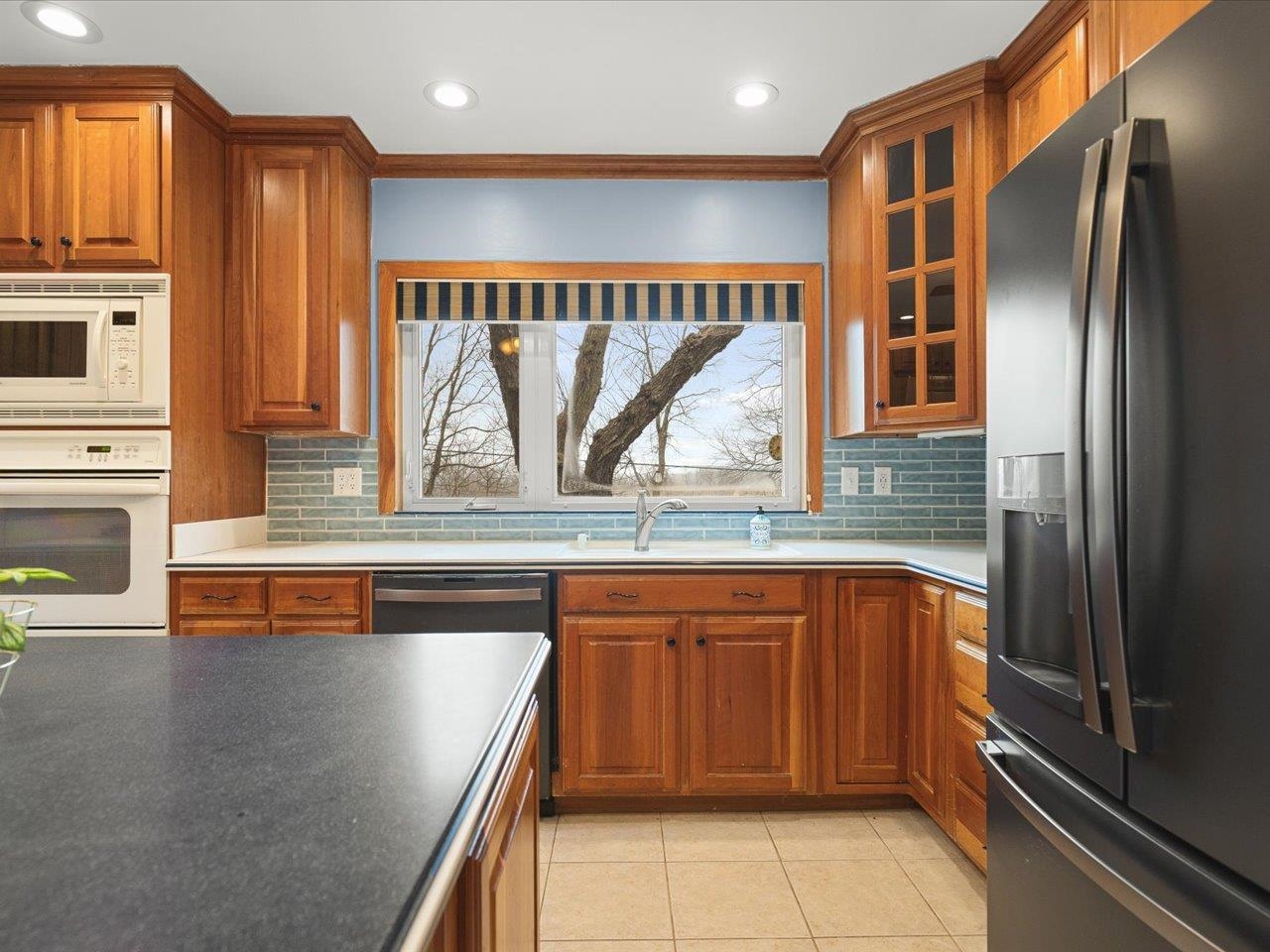 2014 Glenview Road Rockford, IL 61107 - Photo 38 of 82 a kitchen with stainless steel appliances granite countertop a refrigerator and a sink