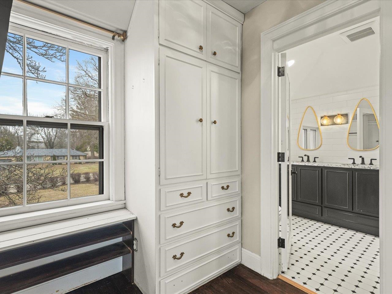 2014 Glenview Road Rockford, IL 61107 - Photo 41 of 82 a bathroom with a sink a vanity and a shower