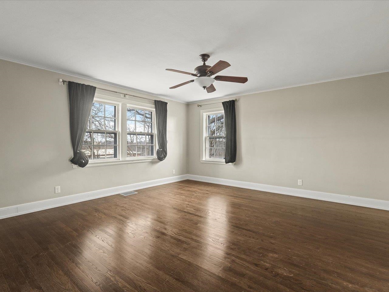 2014 Glenview Road Rockford, IL 61107 - Photo 45 of 82 a view of an empty room with a window and wooden floor