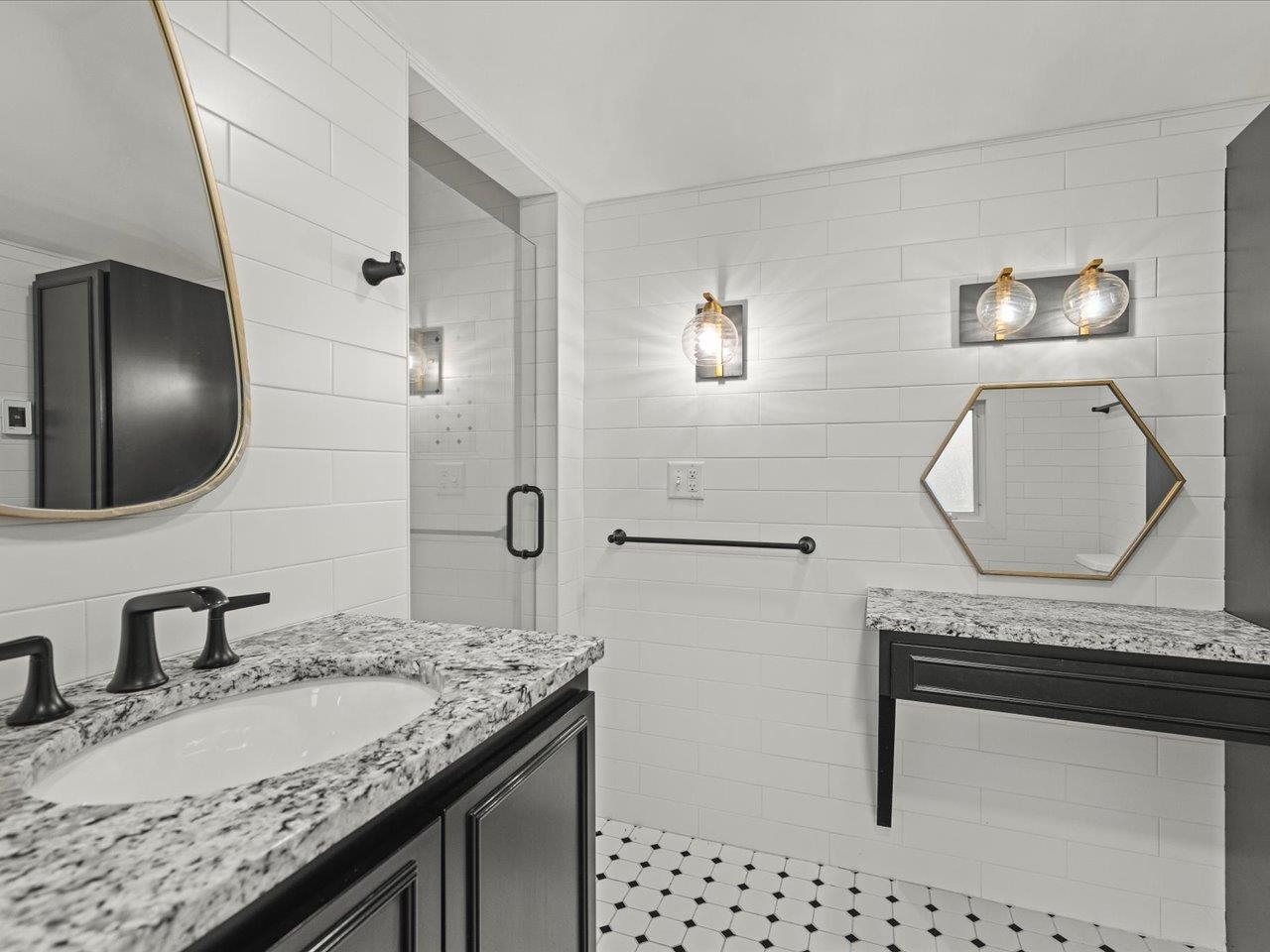 2014 Glenview Road Rockford, IL 61107 - Photo 46 of 82 a bathroom with a granite countertop double vanity sink and a mirror