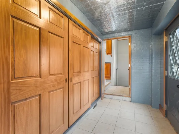 a view of an entryway with wooden floor and windows