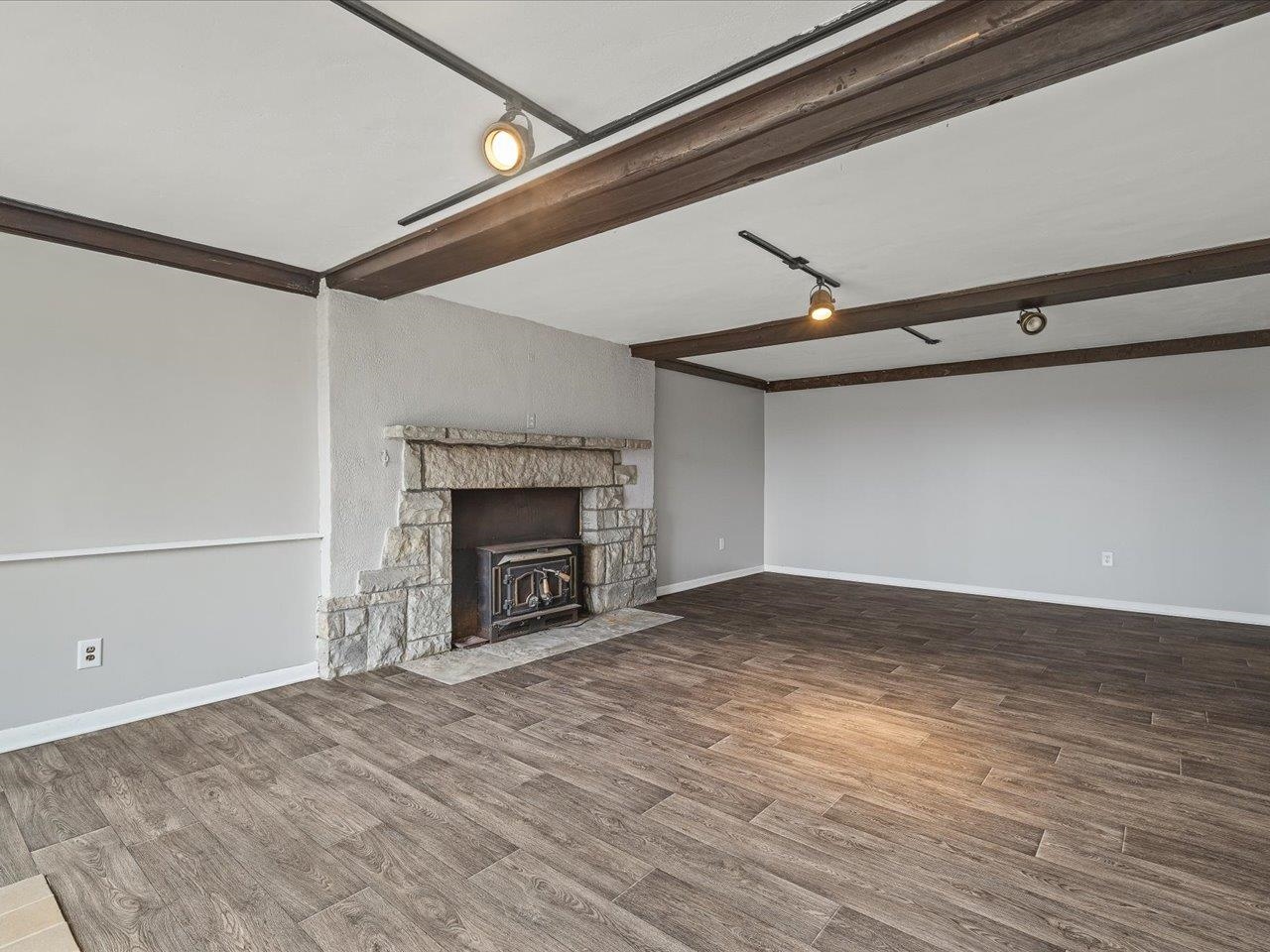 2014 Glenview Road Rockford, IL 61107 - Photo 58 of 82 a view of an empty room with a fireplace and a window
