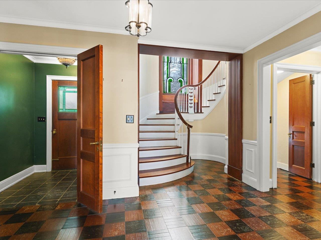 2014 Glenview Road Rockford, IL 61107 - Photo 7 of 82 a view of a hallway with wooden floor and staircase