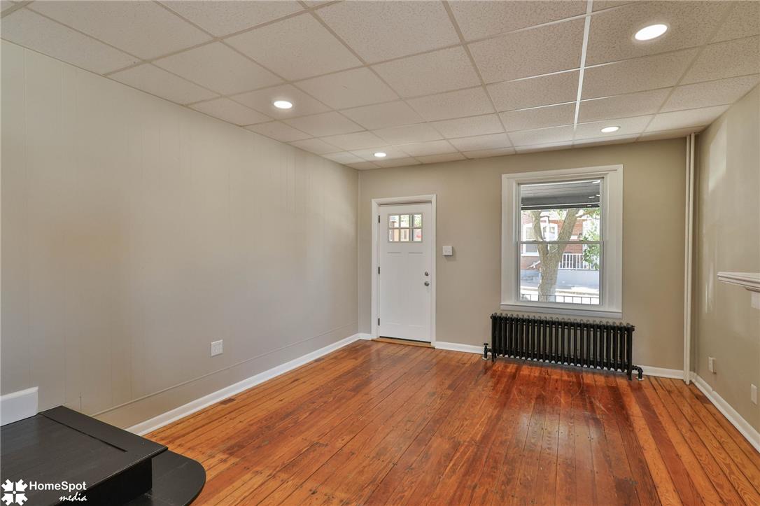 619 Sioux Street Bethlehem, PA 18015 - Photo 13 of 61 an empty room with wooden floor and windows
