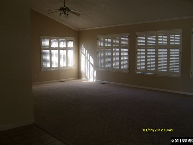 735 Icarus Court Reno, NV 89512 - Photo 2 of 13 an empty room with a empty space and windows