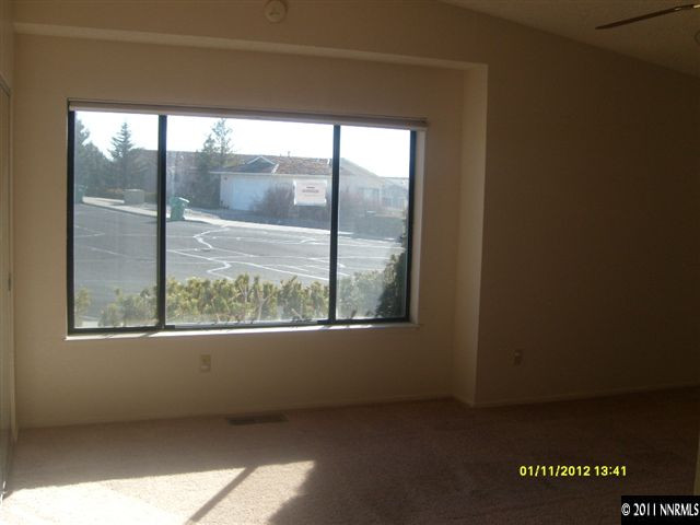 735 Icarus Court Reno, NV 89512 - Photo 9 of 13 a view of an empty room with a window