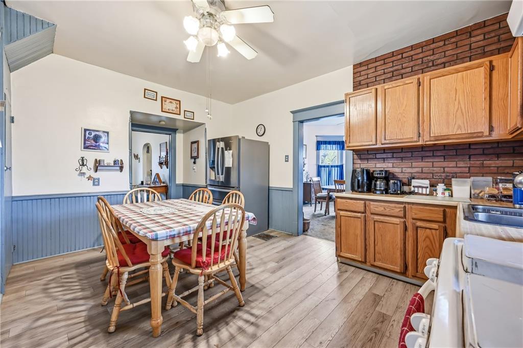 753 Spruce Avenue Sharon, PA 16146 - Photo 14 of 31 a dining room with a wooden table and chairs