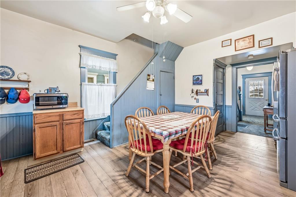 753 Spruce Avenue Sharon, PA 16146 - Photo 16 of 31 a dining room with furniture and wooden floor