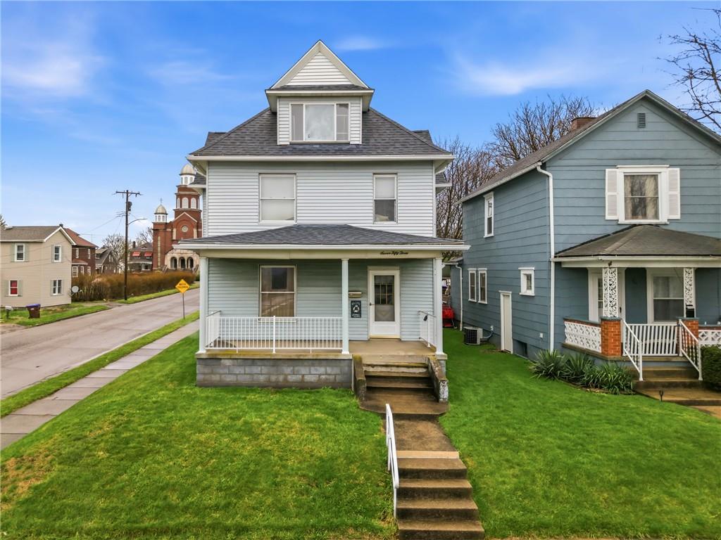 753 Spruce Avenue Sharon, PA 16146 - Photo 2 of 31 a front view of a house with a yard