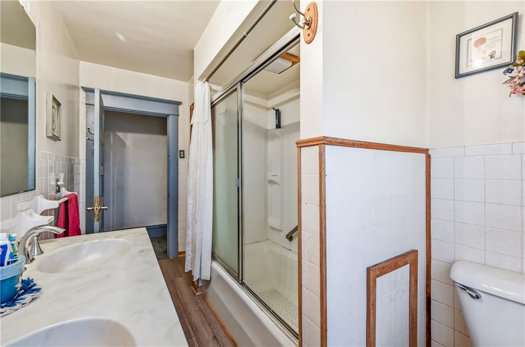 753 Spruce Avenue Sharon, PA 16146 - Photo 22 of 31 a en suite bathroom with a sink and a shower