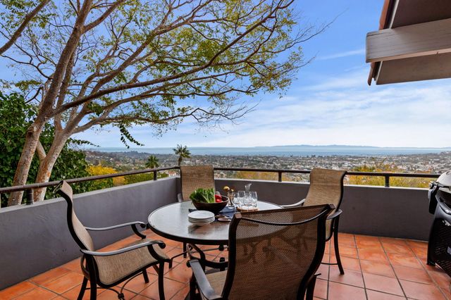 a view of a chairs and table in the patio