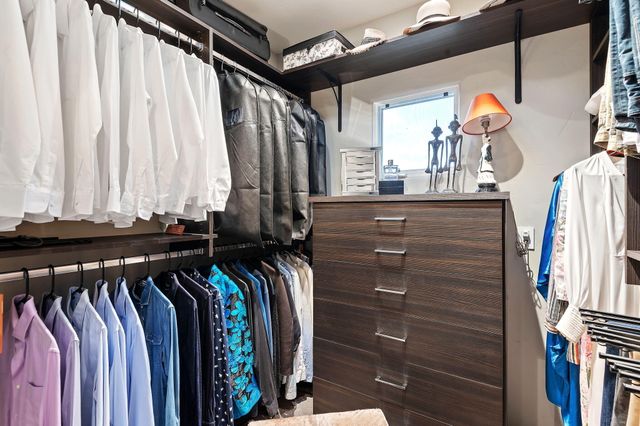 an aerial view of residential building and trees around