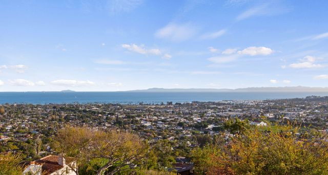 a view of a chairs and table in the balcony