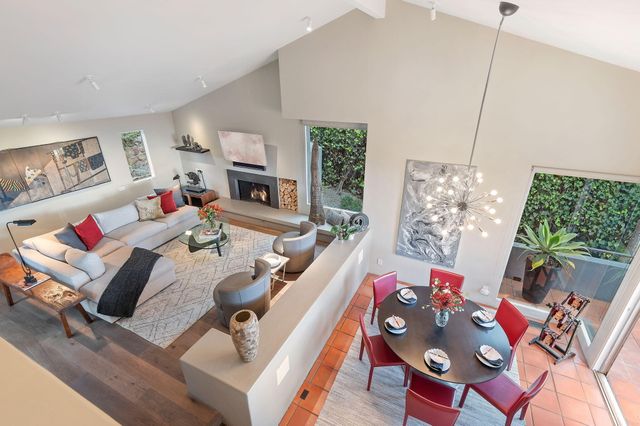 a view of staircase with railing and white wall