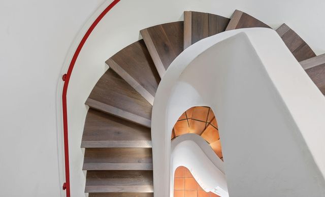 front view of a house with a tree