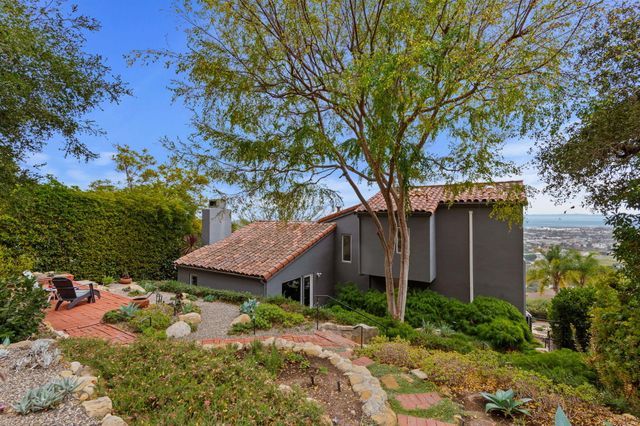 a view of a backyard with sitting area