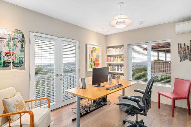 a workspace with furniture and a window