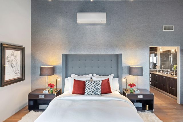 a bed room with bed and window