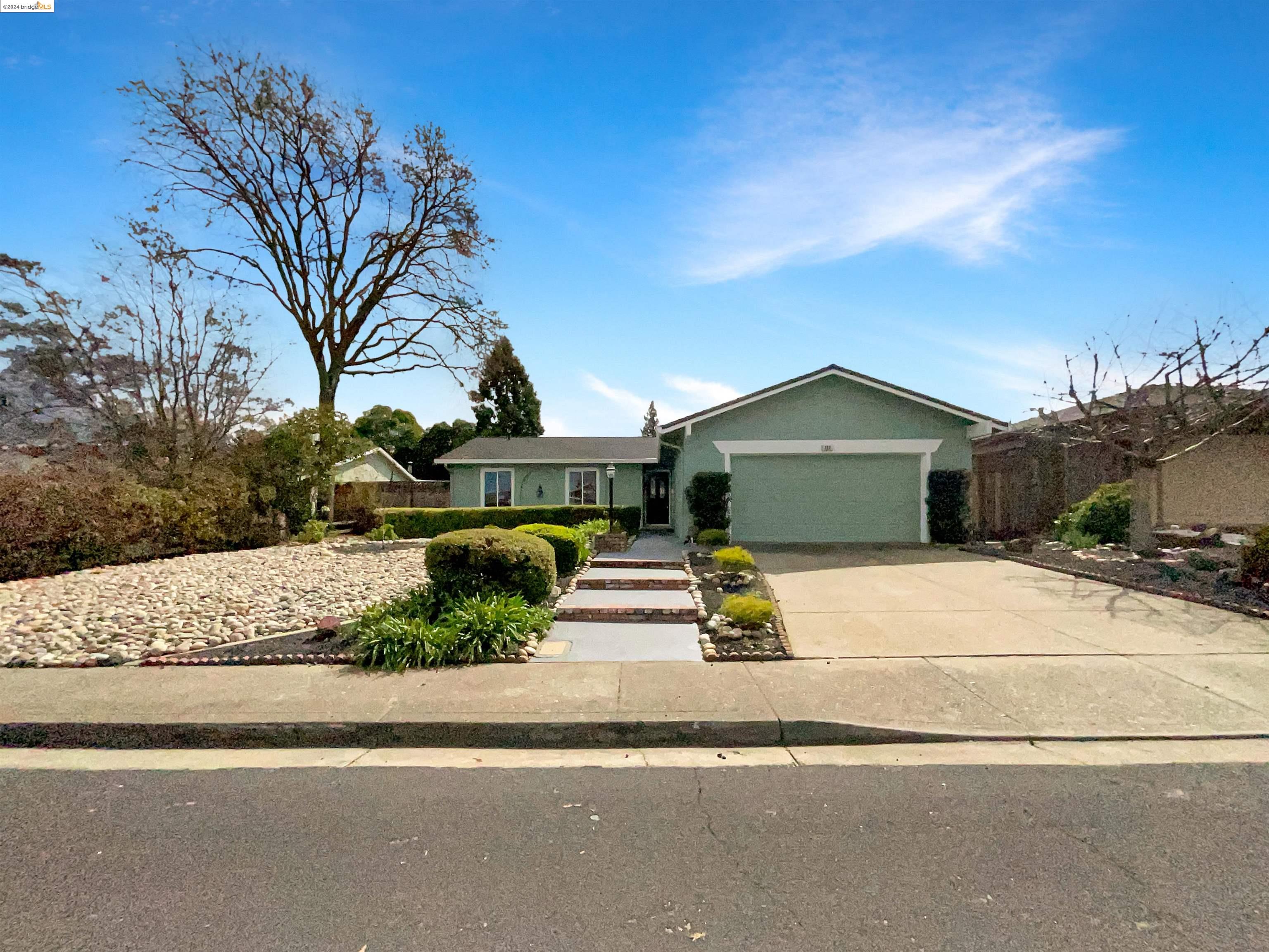 422 Pinenut Court San Ramon, CA 94583 - Photo 1 of 1 a front view of a house with a yard and potted plants