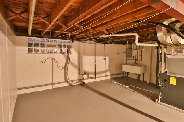 a view of a room with wooden floor and windows