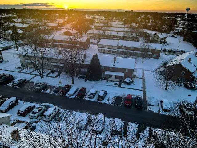 an aerial view of a city with lots of residential buildings