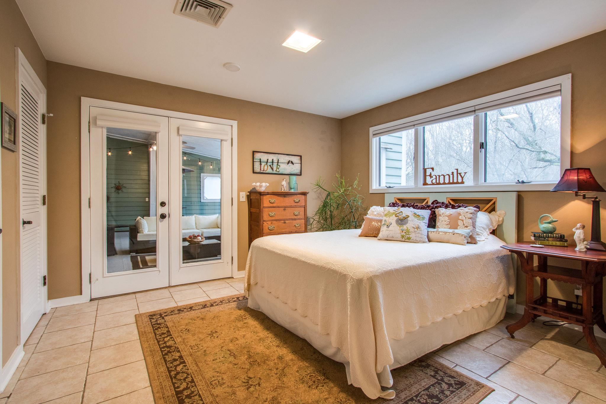 1922 Arlington Road Lebanon, TN 37087 - Photo 15 of 30 a bedroom with a large bed and a large window