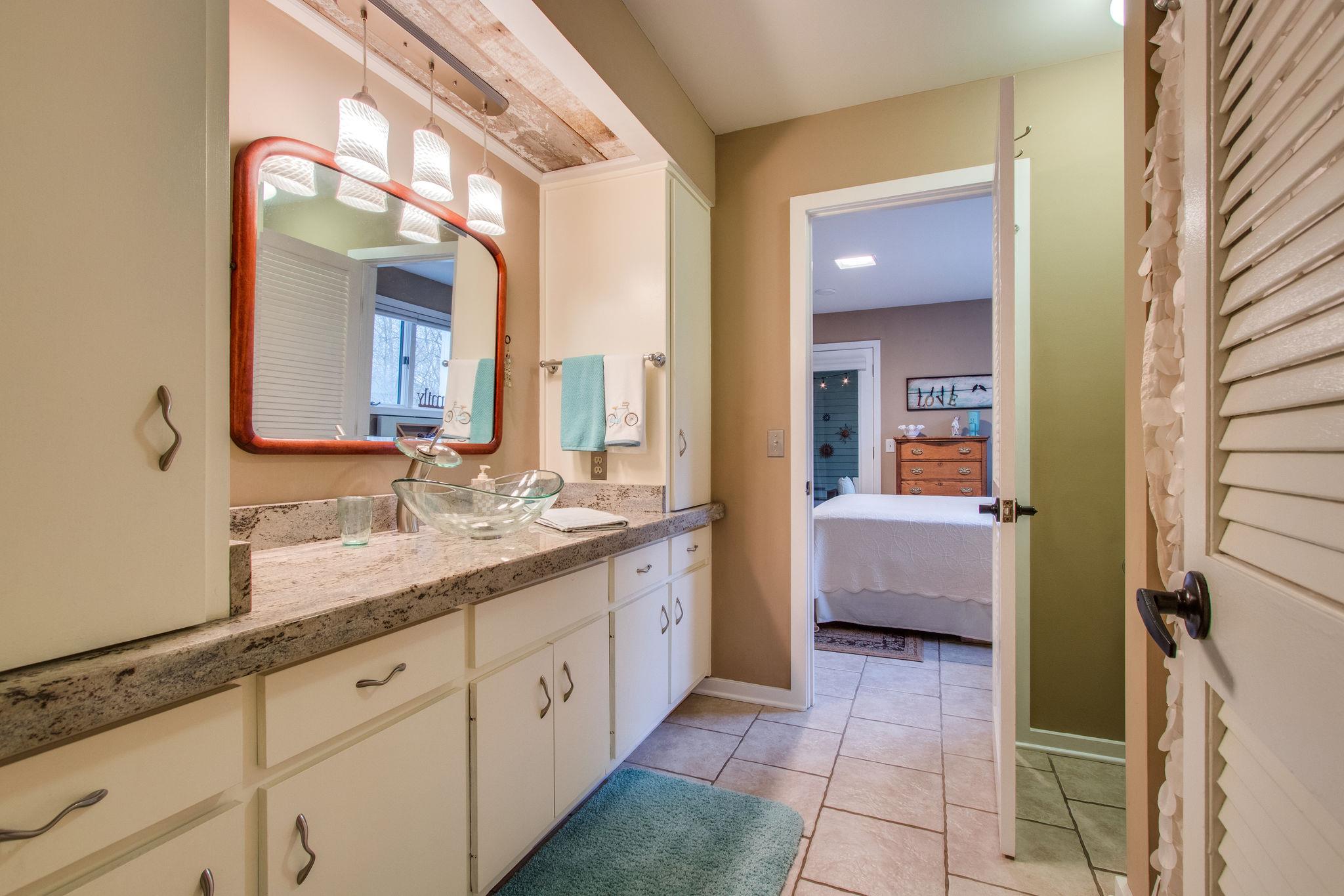 1922 Arlington Road Lebanon, TN 37087 - Photo 16 of 30 a spacious bathroom with a double vanity sink a mirror and a bathtub