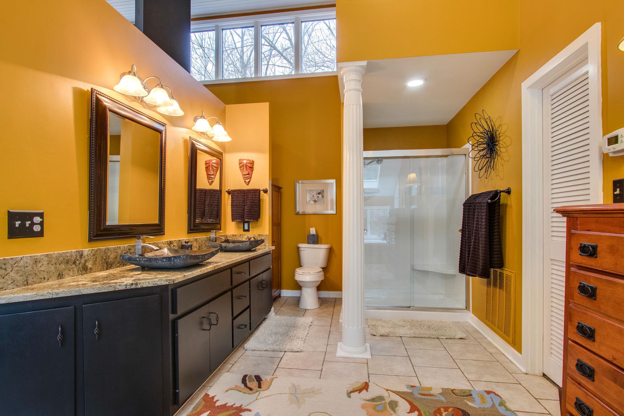 1922 Arlington Road Lebanon, TN 37087 - Photo 23 of 30 a bathroom with a granite countertop sink and a mirror