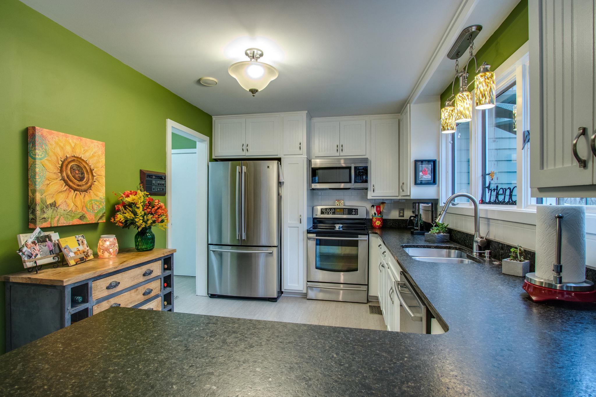 1922 Arlington Road Lebanon, TN 37087 - Photo 8 of 30 a kitchen with stainless steel appliances a stove refrigerator sink and microwave