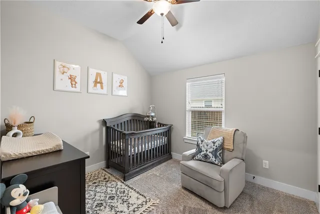 a bedroom with furniture and a window