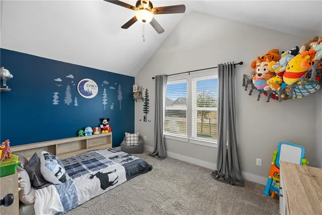 a bedroom with furniture and a window