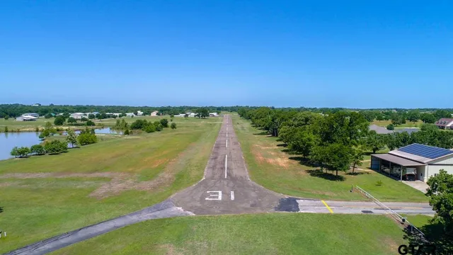 an aerial view of a house with a garden