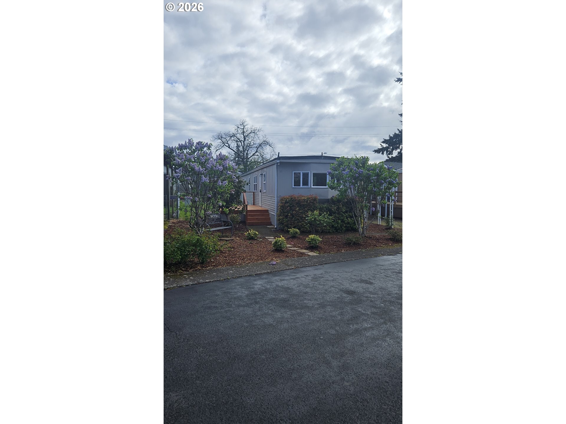 18780 South Central Point Road, Unit 20 Oregon City, OR 97045 - Photo 1 of 16 a view of a backyard with sitting area