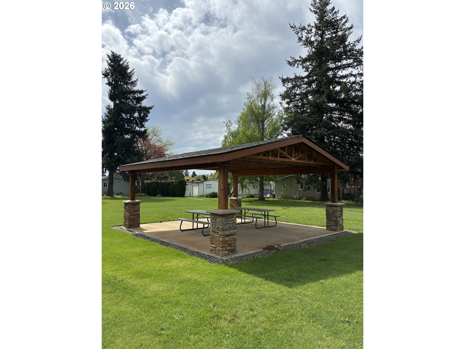 18780 South Central Point Road, Unit 20 Oregon City, OR 97045 - Photo 15 of 16 a view of outdoor space with garden and trees