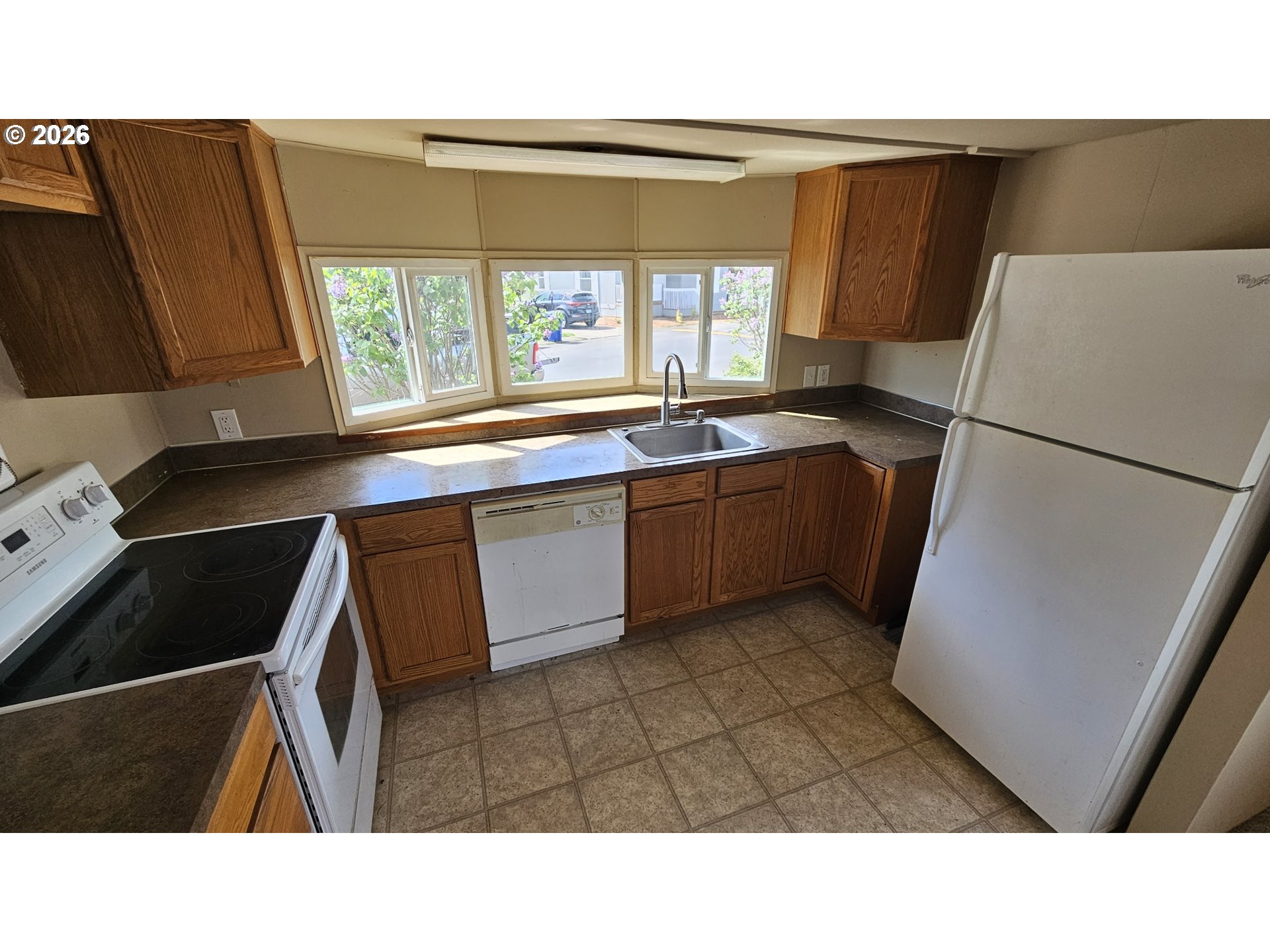 18780 South Central Point Road, Unit 20 Oregon City, OR 97045 - Photo 7 of 16 a kitchen with a refrigerator and a sink
