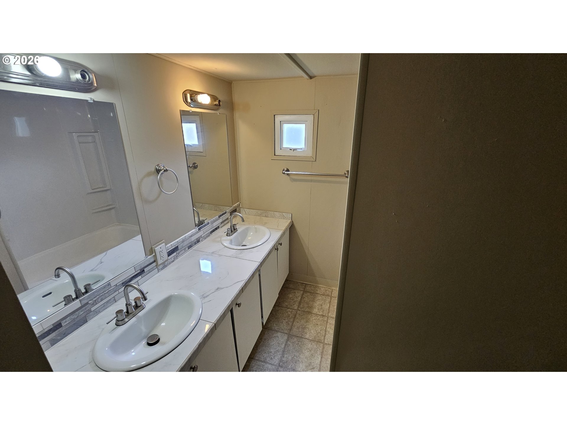 18780 South Central Point Road, Unit 20 Oregon City, OR 97045 - Photo 10 of 16 a bathroom with a sink vanity and mirror