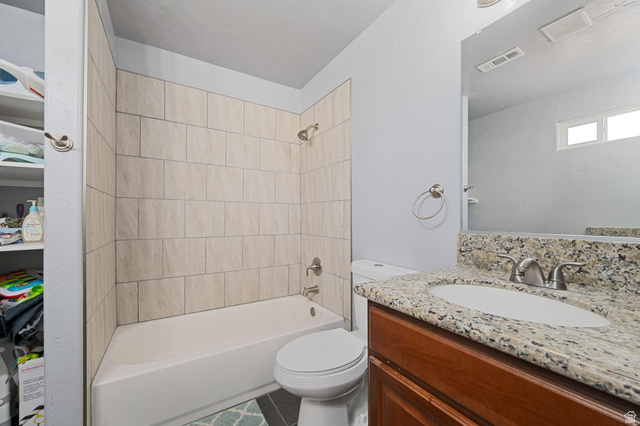 348 North Lodge Road Central, UT 84722 - Photo 8 of 25 Bathroom with vanity, bathing tub / shower combination, and tile patterned floors