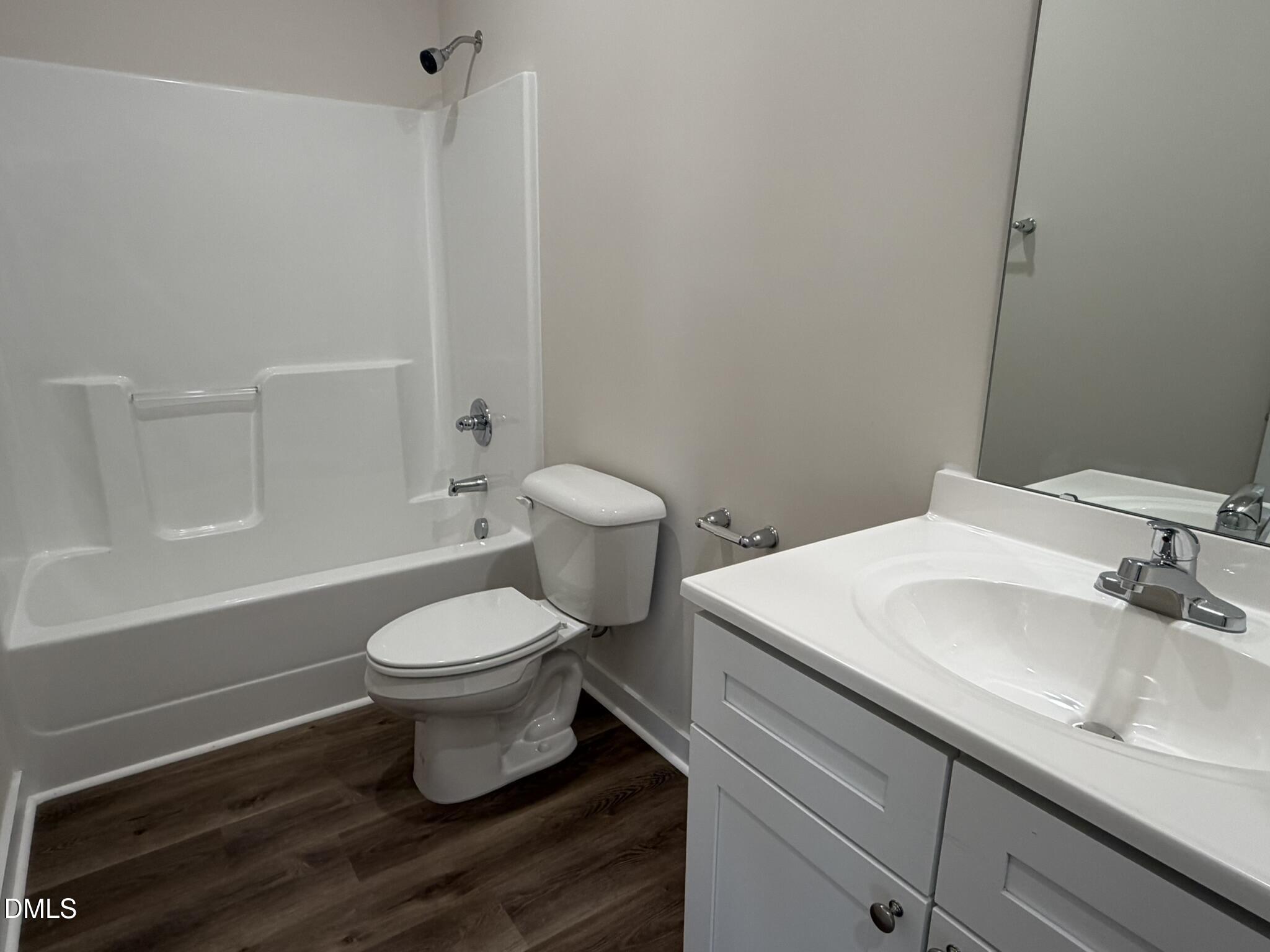 159 Jacobs Ridge Drive Four Oaks, NC 27524 - Photo 15 of 18 a bathroom with a sink toilet and shower