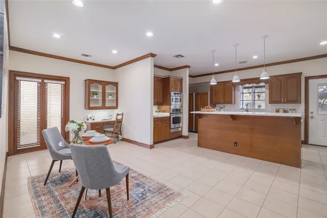 a living room with stainless steel appliances kitchen island granite countertop furniture and a kitchen view