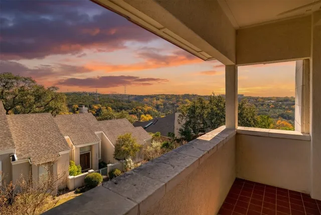 a view of a balcony with city view