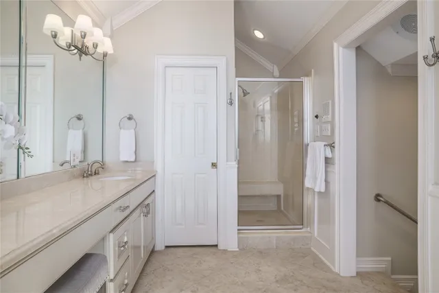 a bathroom with a granite countertop sink a mirror and a shower