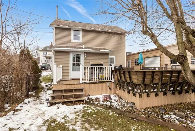 a view of a house with wooden fence