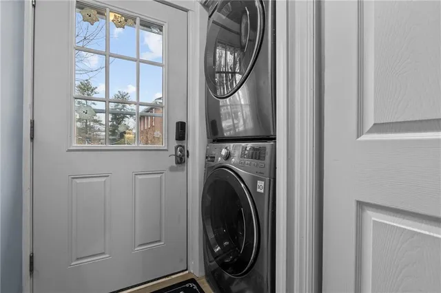a view of a hallway with washer and dryer