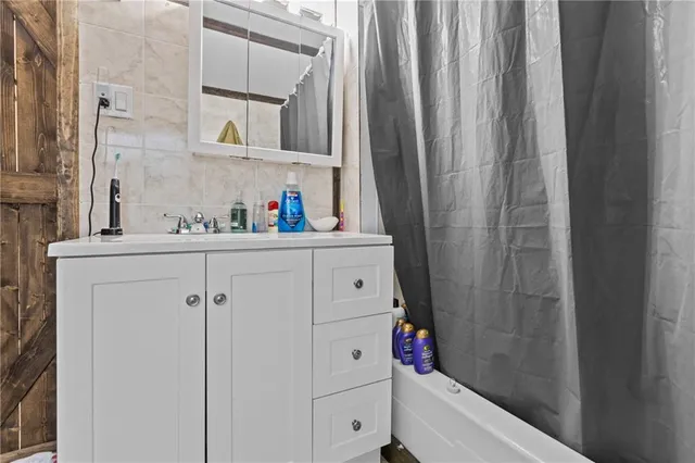 a bathroom with a sink and a mirror